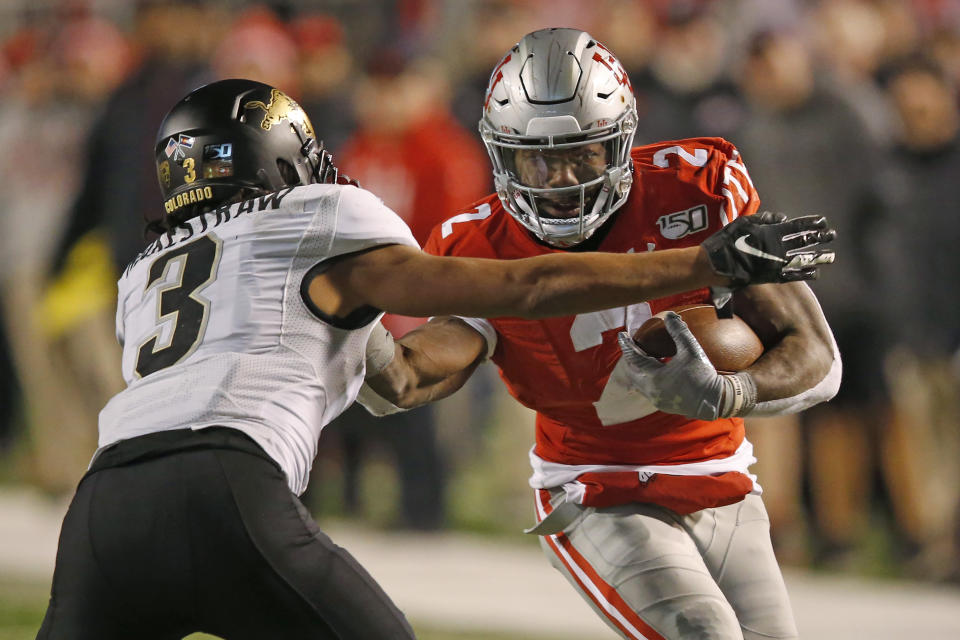 Colorado safety Derrion Rakestraw (3) tackles Utah running back Zack Moss (2) in the second half during an NCAA college football game Saturday, Nov. 30, 2019, in Salt Lake City. (AP Photo/Rick Bowmer)