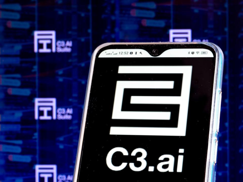 A smartphone with the C3.ai logo on the screen.