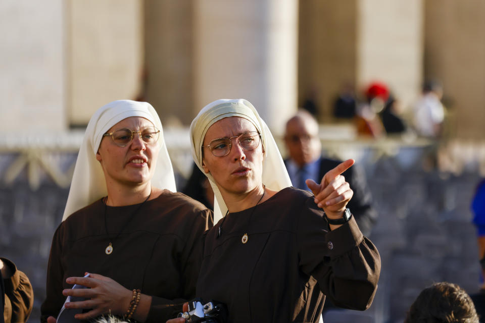 Two nuns wait in St. Peter's Square at The Vatican, Saturday, Sept. 30, 2023, for a consistory where Pope Francis will create 21 new cardinals to start. (AP Photo/Riccardo De Luca)