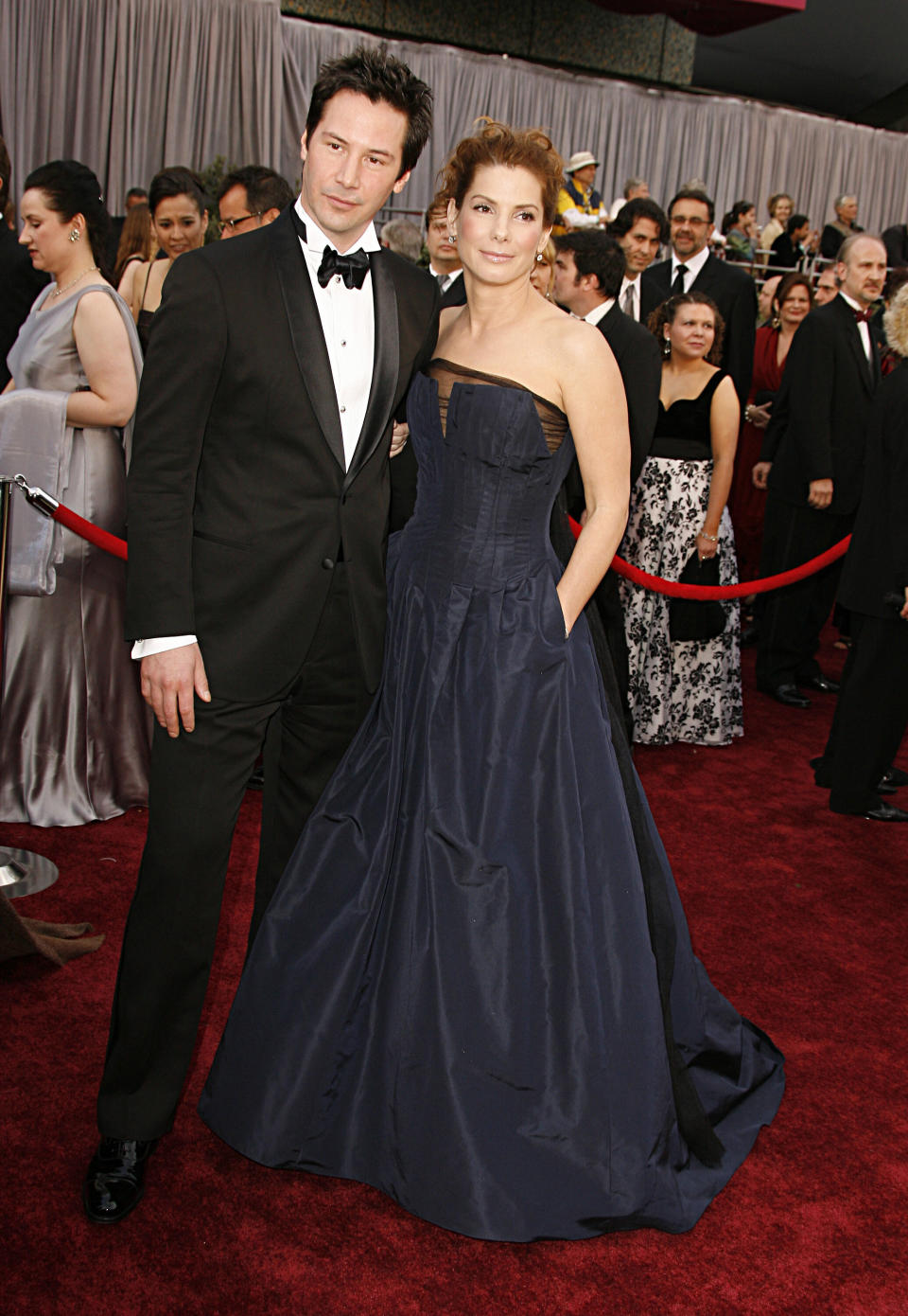 Reeves and Sandra Bullock arrive at the 78th Annual Academy Awards at the Kodak Theatre in Hollywood.