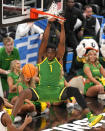 Oregon's N'Faly Dante dunks against South Carolina during the second half of a first-round college basketball game in the NCAA Tournament in Pittsburgh, Thursday, March 21, 2024. (AP Photo/Gene J. Puskar)