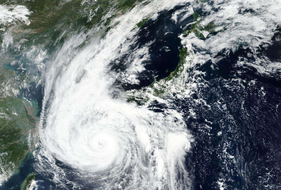 FILE - This Sept. 6, 2020, file satellite image released by NASA Worldview, Earth Observing System Data and Information System (EOSDIS) shows Typhoon Haishen barreling toward the main southwestern island of Kyushu. The second powerful typhoon to slam Japan in a week has unleashed fierce winds and rain on southern islands, blowing off rooftops and leaving homes without power as it edged northward into an area vulnerable to flooding and mudslides. (NASA via AP, File)