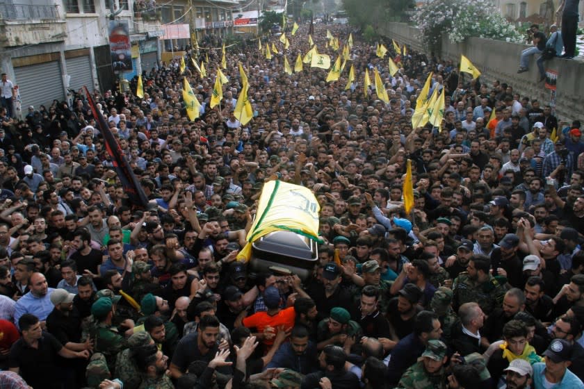 Members and supporters of Lebanon's Shiite militant group Hezbollah carry the coffin of top military commander Mustafa Badreddine during his funeral in southern Beirut on May 13.