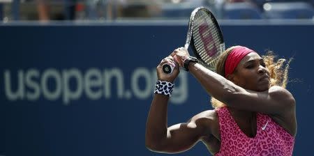 Serena Williams of the U.S. hits a return to compatriot Vania King at the 2014 U.S. Open tennis tournament in New York, August 28, 2014. REUTERS/Mike Segar