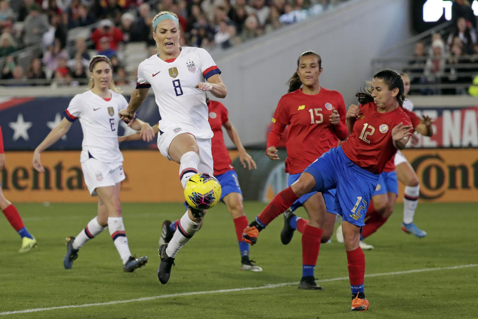 U.S. midfielder Julie Ertz (8) attempts a shot on goal off a corner kick, against Costa Rica defender Lixy Rodriguez (12) during the first half of an international friendly soccer match Sunday, Nov. 10, 2019, in Jacksonville, Fla. (AP Photo/John Raoux)