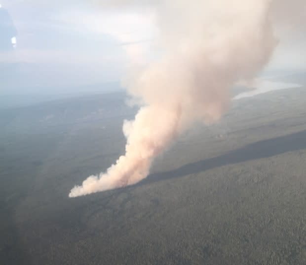 A wildfire burning in Yukon in July. Fire officials said there were 69 wildfires burning in the territory on Monday. (Yukon Protective Services/Twitter - image credit)