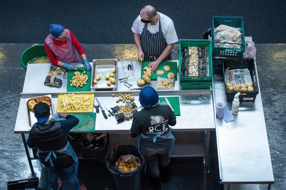 <p>Happy chopper: Vincent Wood, far right, gets to work in the kitchen</p> (Daniel Hambury/Stella Pictures Ltd)