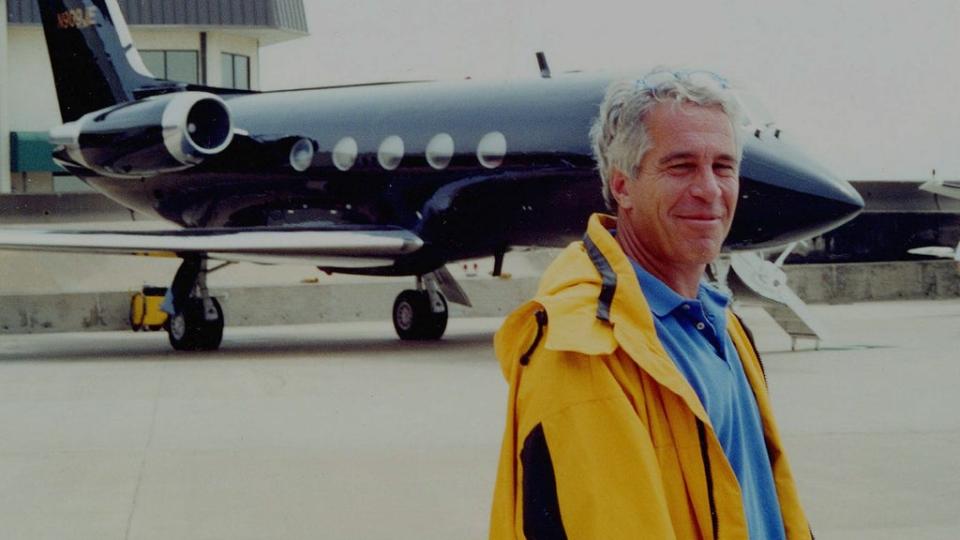 Jeffrey Epstein pictured in front of one of his private jets (Court documents)