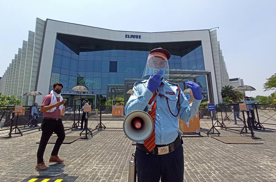 CHANDIGARH, INDIA - JUNE 8: A security guards makes social distancing announcements using a loudspeaker at Elante Mall, on June 8, 2020 in Chandigarh, India. (Photo by Ravi Kumar/Hindustan Times via Getty Images)
