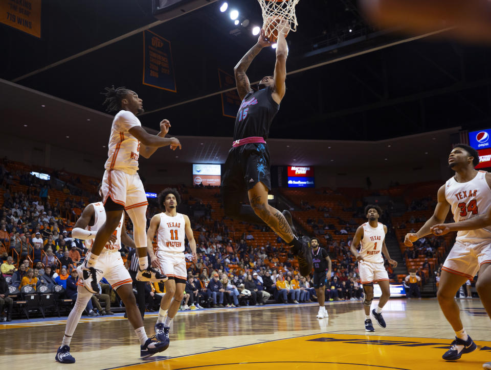 Florida Atlantic guard Alijah Martin (15) goes up for a shot as UTEP guard Shamar Givance (5) defends during the first half of an NCAA college basketball game Saturday, Jan. 21, 2023, in El Paso, Texas. (AP Photo/Andrés Leighton)