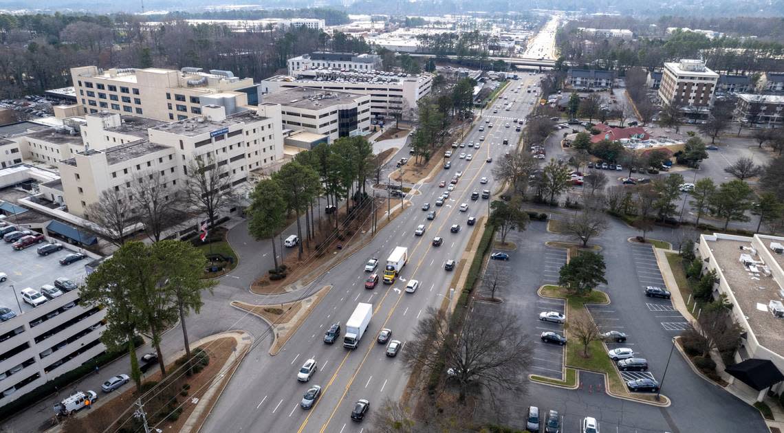 Traffic flows along narrow lanes of traffic on Wake Forest Road north of the I-440 Beltline on Thursday, Jan. 19, 2023.