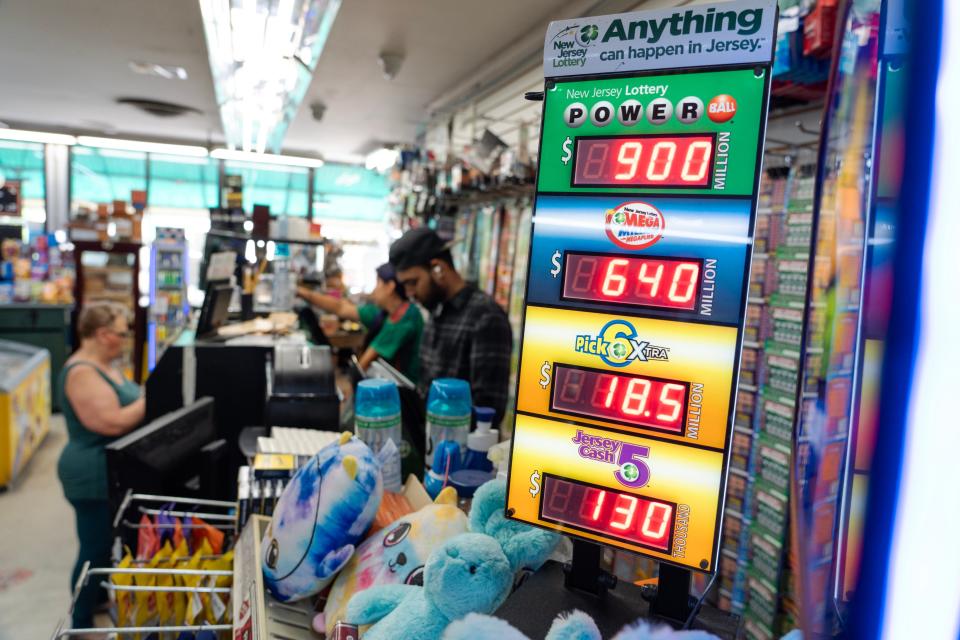 Customers try their luck on the $900M Powerball at Union Food Store in Totowa, NJ on Monday July 17, 2023. 