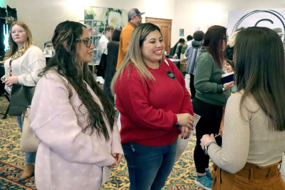 Alex Saucedo and Brittany Granados talk to vendors at the 2023 Amarillo Bridal Show held at the Amarillo Civic Center Sunday afternoon.