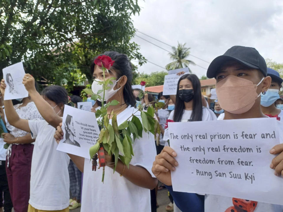 Demonstrators hold papers with Aung San Suu Kyi's famous quote, as they march during a rally to mark the 79th birthday of the country’s ousted leader Aung San Suu Kyi in Launglon township in Tanintharyi region, Myanmar, Wednesday, June 19, 2024. (Democracy Movement Strike Committee-Dawei via AP)