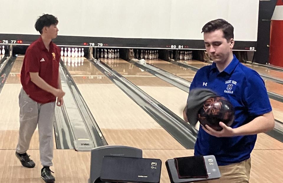 NJSIAA individual bowling finals at Bowlero North Brunswick on Thursday, Feb. 29, 2024. Max Heun of St. Mary (right) prepares to take a shot as Andy Lee of Bergen Catholic (left) finishes up his frame.