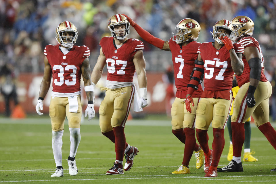 SANTA CLARA, CALIFORNIA – JANUARY 20: Nick Bosa #97 of the San Francisco 49ers is congratulated by Charvarius Ward #7 after a defensive stop during the first quarter against the Green Bay Packers in the NFC Divisional Playoffs at Levi’s Stadium on January 20, 2024 in Santa Clara, California. (Photo by Lachlan Cunningham/Getty Images)