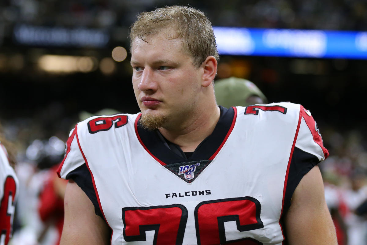 Atlanta Falcons offensive tackle Kaleb McGary (76), left, works against an  unidentifed teammate during the first day of team's NFL football training  camp pratice Wednesday, July 26, 2023, in Flowery Branch, Ga. (