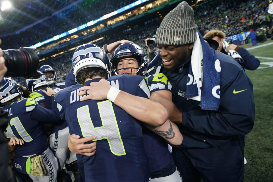 Seattle Seahawks place-kicker Jason Myers (5) celebrates with Seattle Seahawks punter Michael Dickson (4) after he kicks a field goal in the second half of an NFL football game against the Washington Commanders in Seattle, Sunday, Nov. 12, 2023. (AP Photo/Lindsey Wasson)