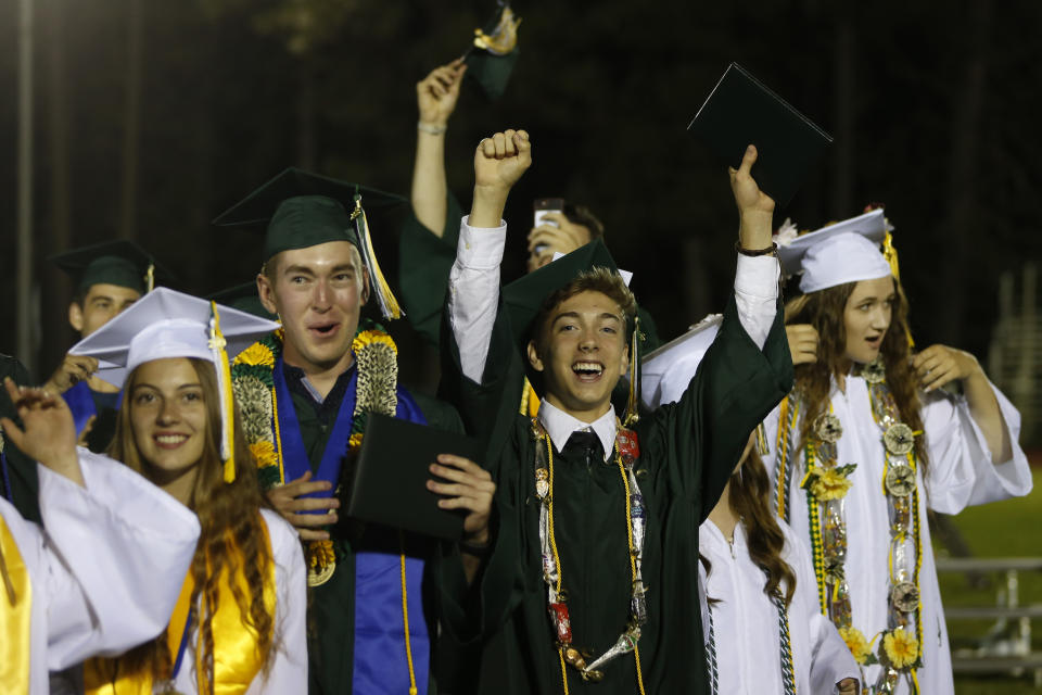 Seniors celebrate at the end of their graduation ceremonies at Paradise High School in Paradise, Calif., Thursday June 6, 2019. Most of the students of Paradise High lost their homes when the Camp Fire swept through the area and the school was forced to hold classes in Chico. The seniors gathered one more time at Paradise High for graduation ceremonies. (AP Photo/Rich Pedroncelli)