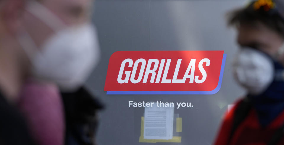 Workers block the entrance of a depot for German startup Gorillas, a grocery delivery company, during a protest against the firing of a colleague in Berlin, Germany, Thursday, June 10, 2021. The delivery service Gorillas now operates in dozens of cities across Germany, France, Italy, the Netherlands and Britain, and has already set its sights on New York. (AP Photo/Markus Schreiber)