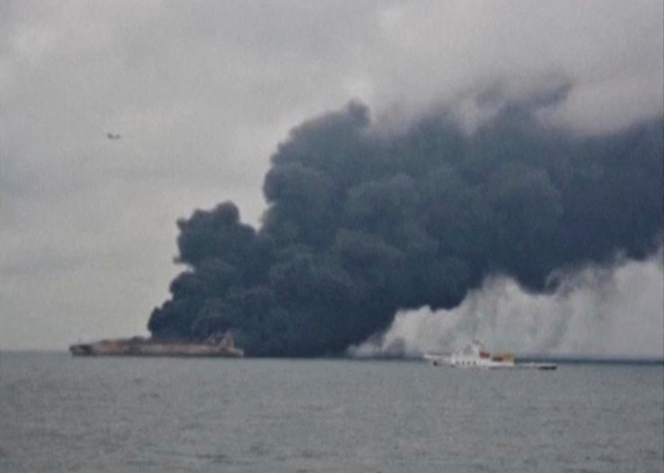 <p>Smoke and fire is seen from Panama-registered tanker Sanchi carrying Iranian oil after it collided with a Chinese freight ship in the East China Sea, in this still image taken from a Jan. 7, 2018 video.(Photo: China Daily via Reuters) </p>