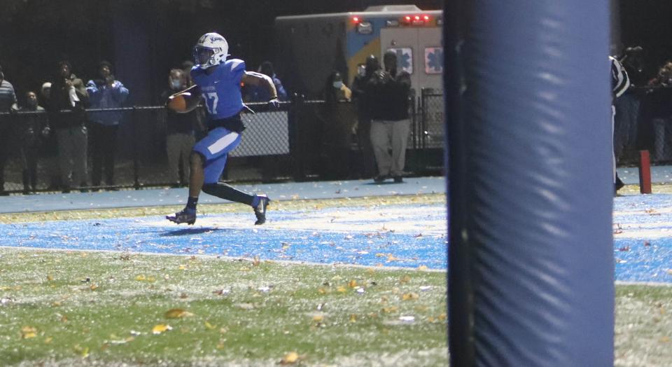 Irvington Blue Knights Nasir Addison (17)  scores Irvington’s first touchdown in  end zone during the varsity football game between the Middletown South Eagles and the Irvington Blue Knights,  held at Irvington High School Friday, November 19th, 2021