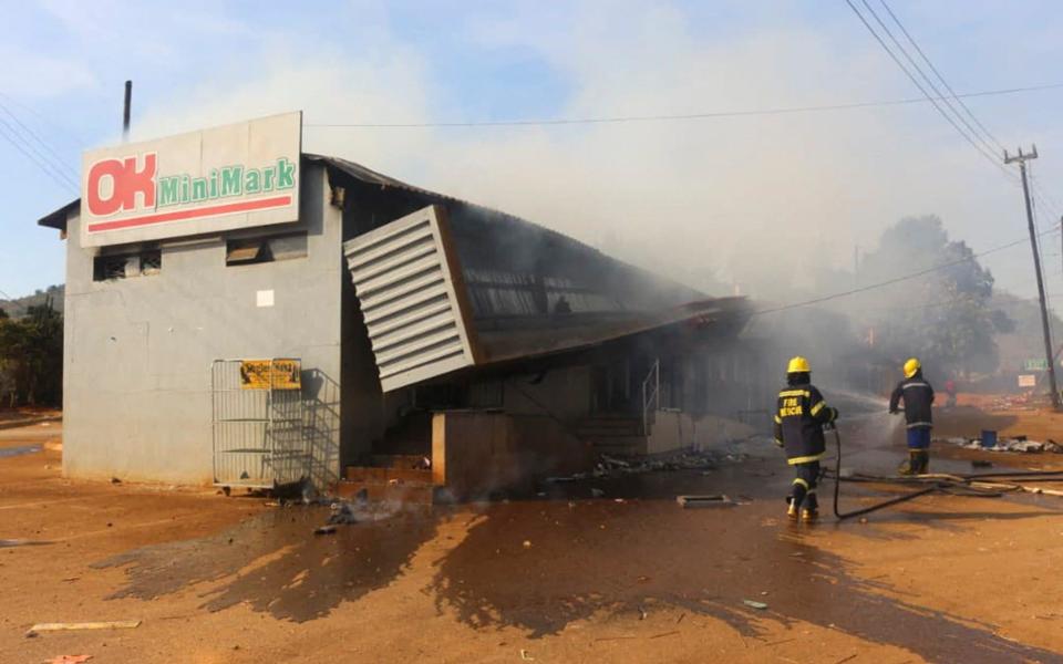 Firefighters extinguish a fire at a supermarket in Manzini, Eswatini, last week - AFP via Getty Images