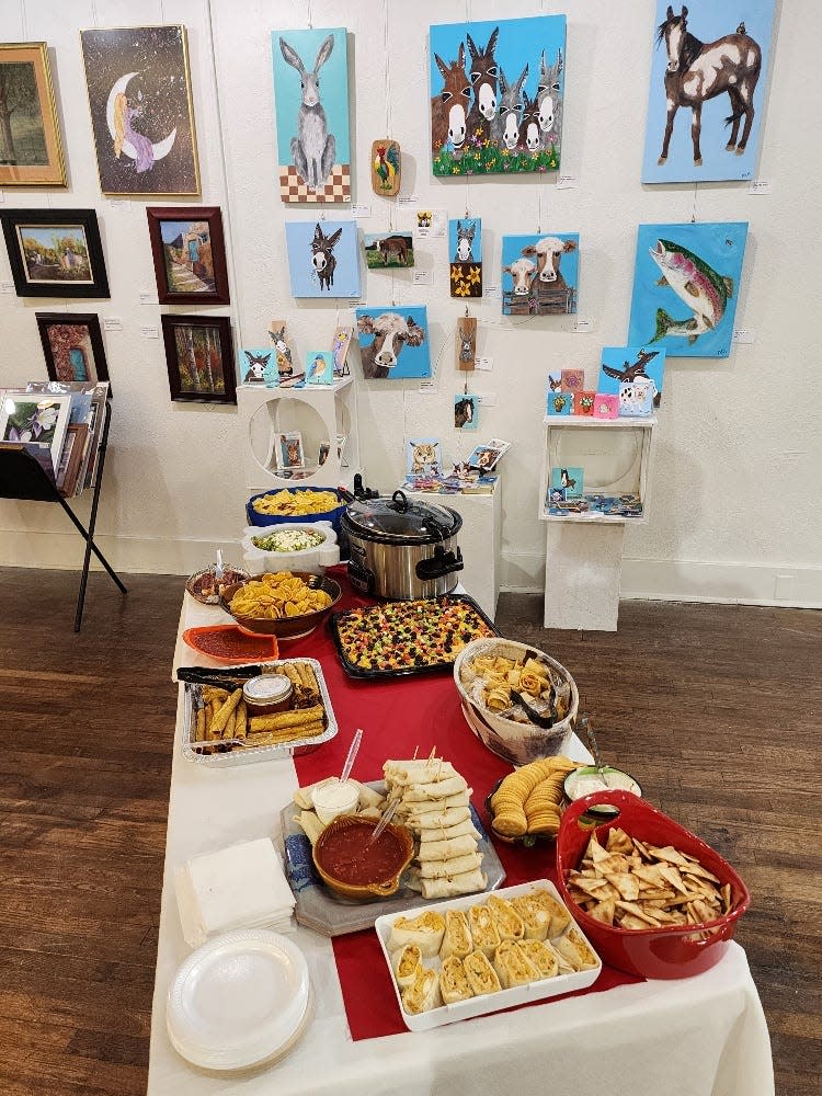 Art and food displayed during May's First Friday Art Walk.