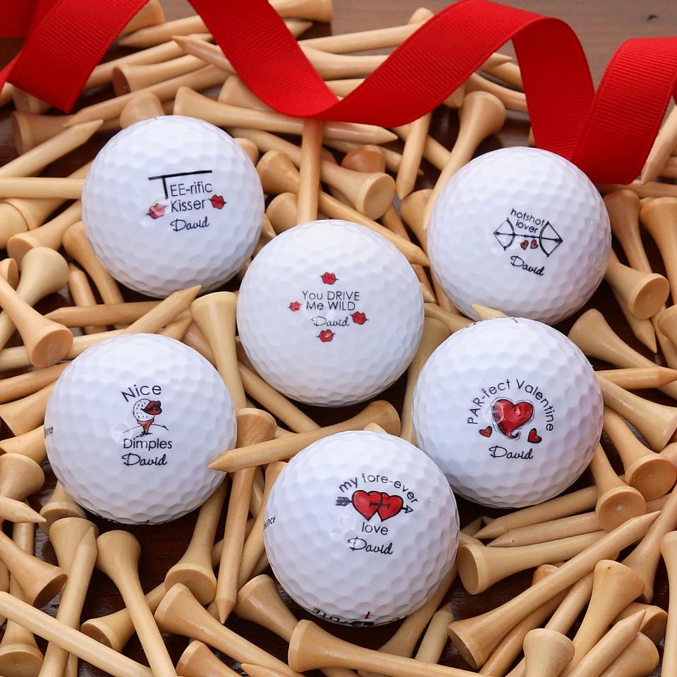 Personalized Loving Hearts Golf Ball Set of 12. Image via Personalization Mall.