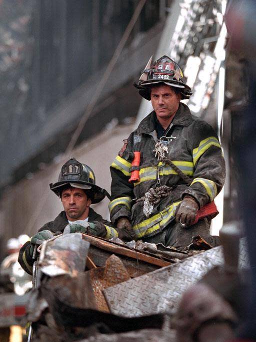 Firemen take a break from searching through the rubble of the World Trade Centre (George W Bush Llibrary)