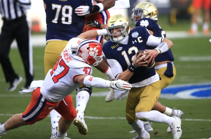 Clemson linebacker James Skalski (47) sacks Notre Dame quarterback Ian Book (12) during the first half of the Atlantic Coast Conference championship NCAA college football game, Saturday, Dec. 19, 2020, in Charlotte, N.C. (AP Photo/Brian Blanco)