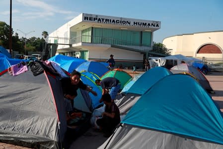 Central American migrants are seen in an encampment in Matamoros