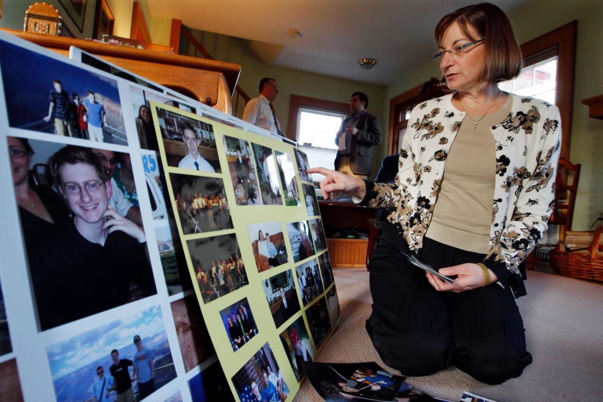 In this Dec. 9, 2011, file photo, Jane Clementi, right, the mother of Tyler Clementi, looks at family photographs in their home in Ridgewood, New Jersey. (Photo: (AP Photo/Mel Evans, File))