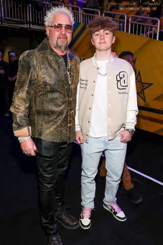 <p>Kevin Mazur/Getty </p> Guy Fieri with son Ryder