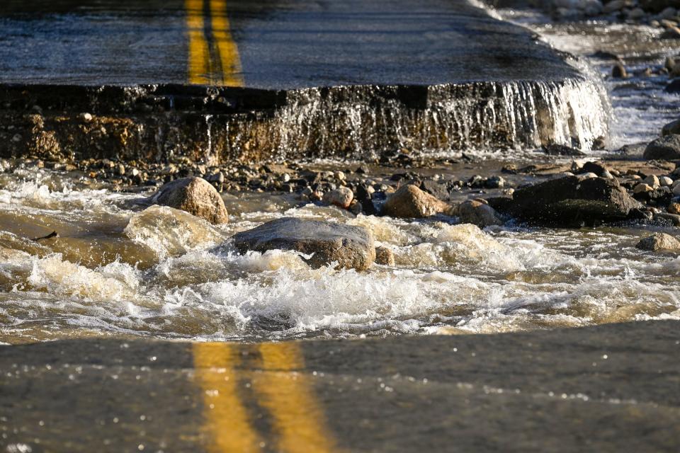 Fair weather Monday, March 13, 2023 brought out many to see damages caused by recent storms. This bridge is on South Fork Road almost two miles from Highway 198.