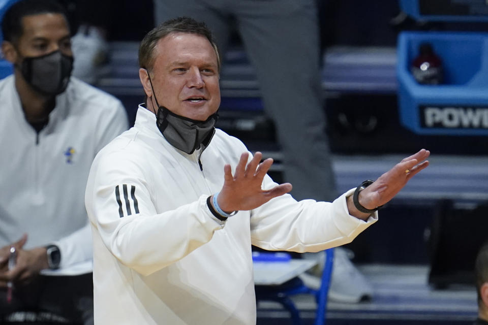 Kansas head coach Bill Self signals against USC during the first half of a men's college basketball game in the second round of the NCAA tournament at Hinkle Fieldhouse in Indianapolis, Monday, March 22, 2021. (AP Photo/Paul Sancya)