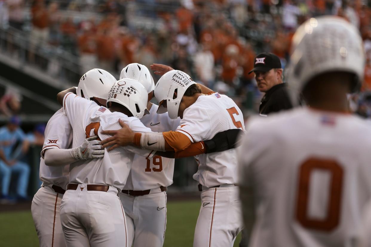 Texas players celebrate Mitchell Daly's fourth-inning grand slam during the Longhorns' 12-4 win over Kansas on Thursday night at UFCU Disch-Falk Field. It was UT's 100th homer of the season. The Longhorns hit three homers in the game.