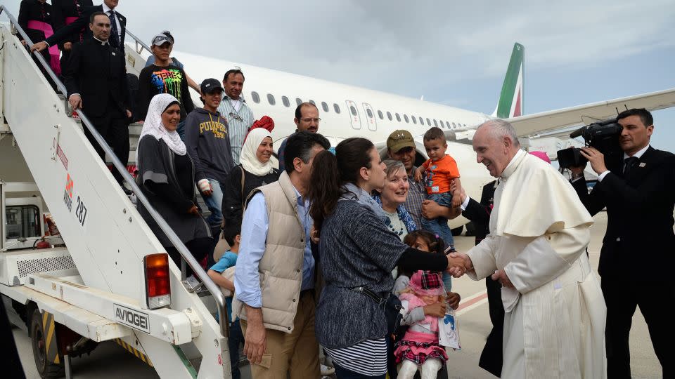 Pope Francis greets a group of Syrian refugees upon landing at Rome's Ciampino airport Saturday, April 16, 2016. - Filippo Monteforte/AP