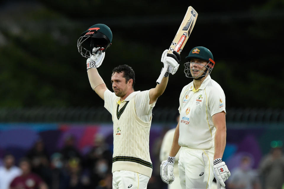 Pictured here, Travis Head raises his bat after a second century of the Ashes series in Hobart. 