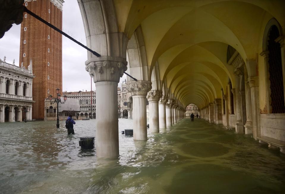 A general view shows a flooded arcade by St. Mark's Square and the Bell Tower (L) on November 15, 2019 in Venice, two days after the city suffered its highest tide in 50 years. - Flood-hit Venice was bracing for another exceptional high tide on November 15, as Italy declared a state of emergency for the UNESCO city where perilous deluges have caused millions of euros worth of damage. (Photo by FILIPPO MONTEFORTE/AFP via Getty Images)