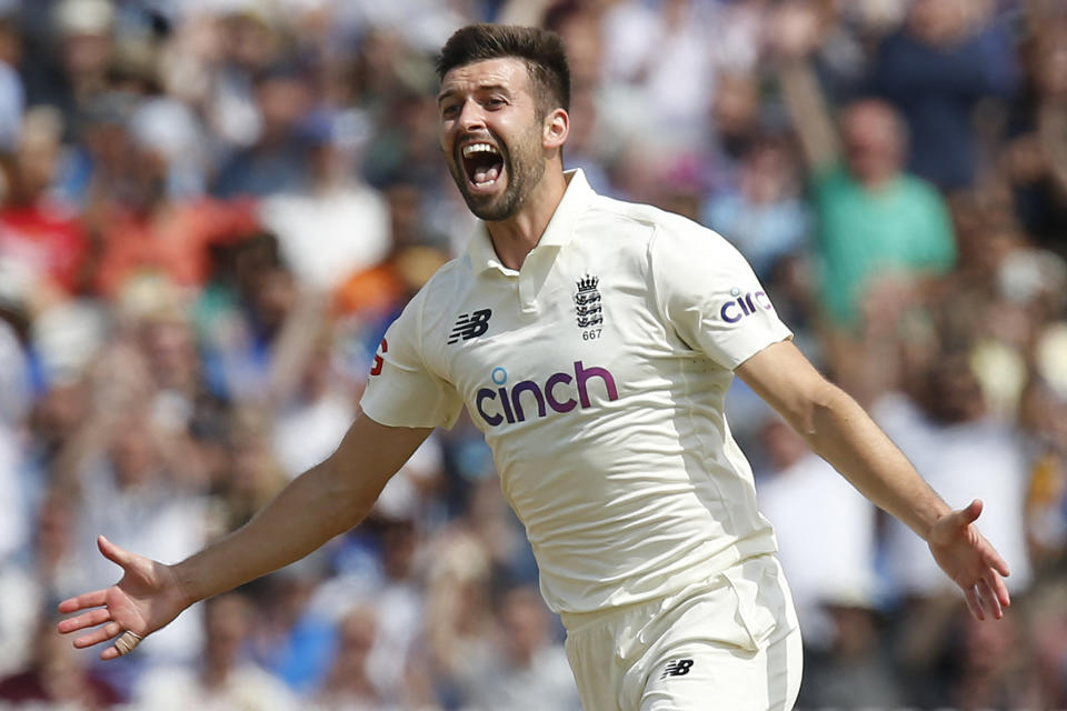 England's Mark Wood celebrates after taking the wicket of India's Rohit Sharma for 21 runs on the fourth day of the second cricket Test match  between England and India at Lord's cricket ground in London on August 15, 2021. (Photo by IAN KINGTON/AFP via Getty Images)