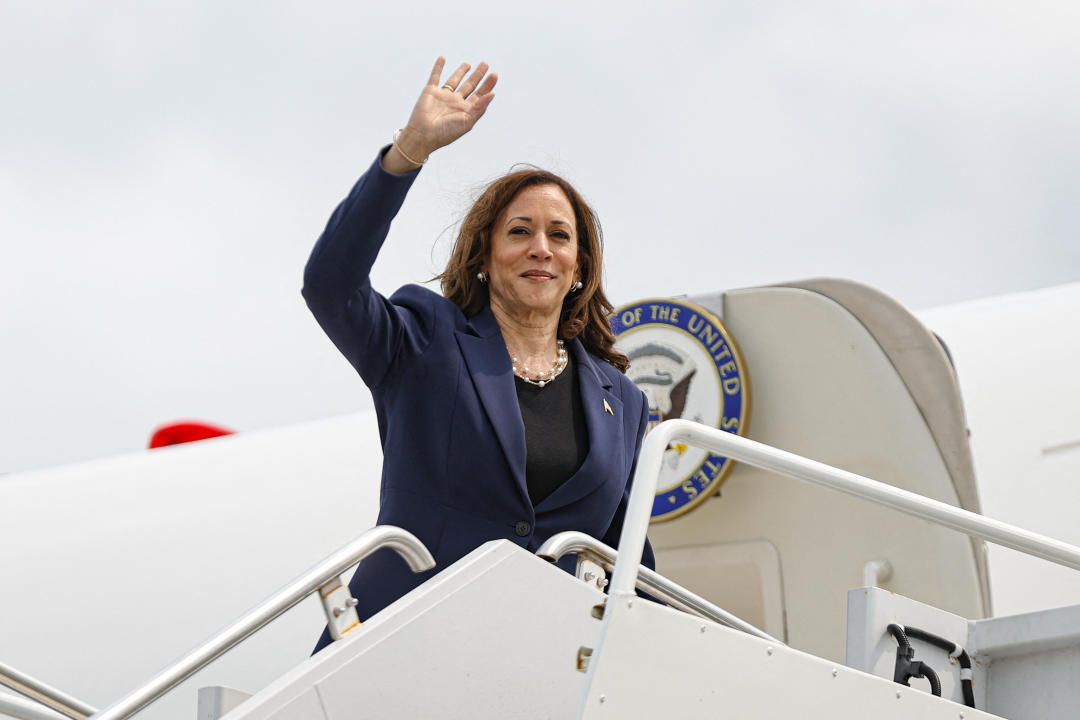 Vice President Kamala Harris waves as she boards Air Force Two in Milwaukee on Tuesday. (Kamil Krzaczynski/AFP via Getty Images)