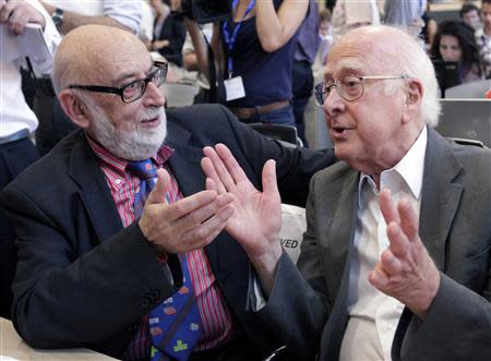 File picture of British physicist Peter Higgs (R) talking with Belgium physicist Francois Englert before a news conference on the search for the Higgs boson at the European Organization for Nuclear Research (CERN) in Meyrin near Geneva July 4, 2012. REUTERS/Denis Balibouse/Files