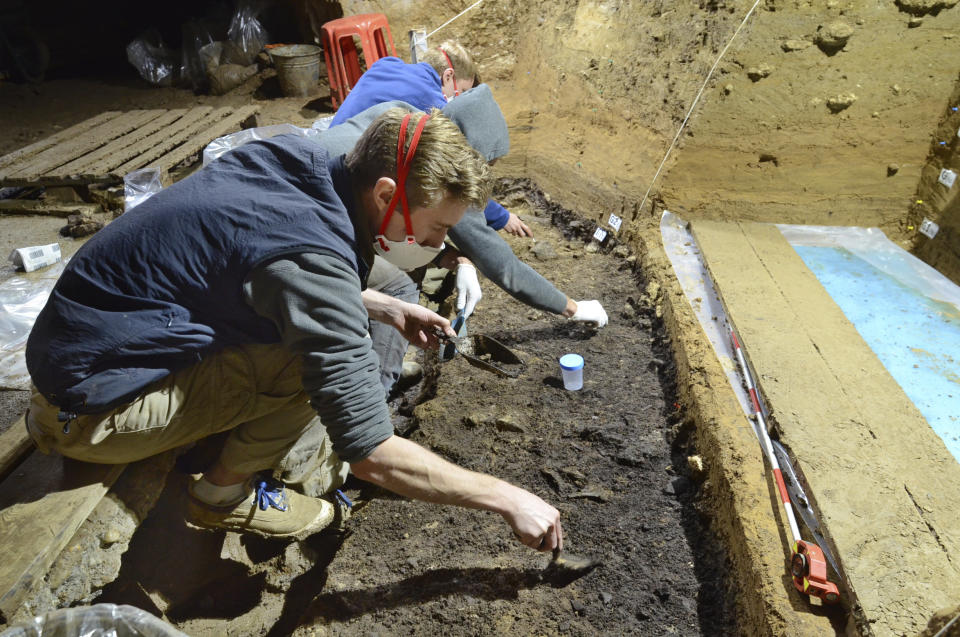 This image provided by Tsenka Tsanova in May 2020 shows excavation work at the Bacho Kiro Cave in Bulgaria. Two new studies Monday, May 11, 2020, show that Homo sapiens bones found in the Bulgarian cave date back to as far as 46,000 years ago, which is thousands of years earlier than previous human fossils in Europe. (Tsenka Tsanova/MPI-EVA Leipzig via AP)