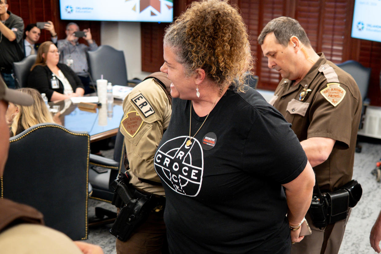 Audra Beasley is arrested Thursday at an Oklahoma State Board of Education meeting at the Oklahoma Capitol.