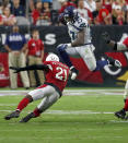 <p>Seattle Seahawks running back Mike Davis (27) leaps over Arizona Cardinals defensive back Patrick Peterson (21) during the second half of an NFL football game, Sunday, Sept. 30, 2018, in Glendale, Ariz. (AP Photo/Rick Scuteri) </p>