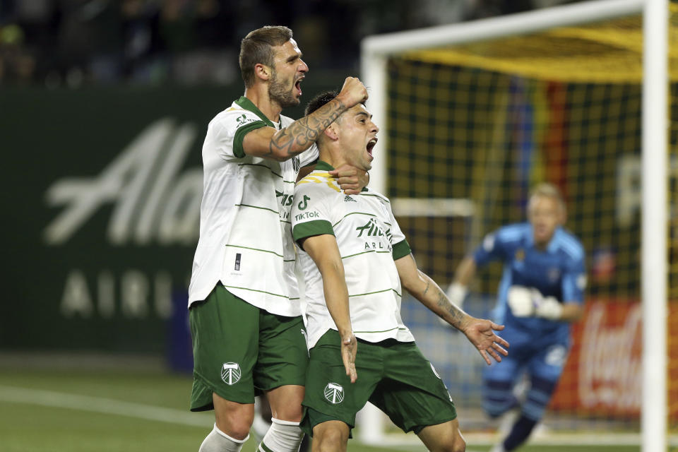 Portland Timbers forward Felipe Mora, front right, celebrates his second-half goal against the Colorado Rapids during an MLS soccer match Wednesday, Sept. 15, 2021, in Portland, Ore. (Sean Meagher/The Oregonian via AP)