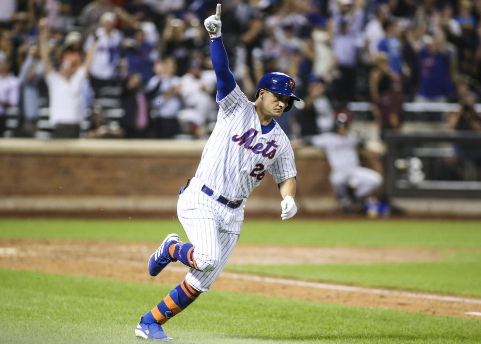 Aug 21, 2019; New York City, NY, USA; New York Mets left fielder J.D. Davis (28) hits a game winning RBI single defeat the Cleveland Indians in the tenth inning to at Citi Field. Mandatory Credit: Wendell Cruz-USA TODAY Sports