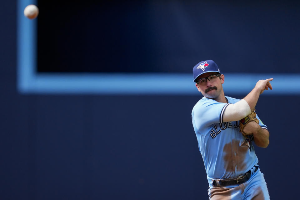 Toronto Blue Jays second baseman Davis Schneider (36) throws to first base on a ground ball by Washington Nationals second baseman Ildemaro Vargas during the second inning of a baseball game in Toronto on Wednesday, Aug. 30, 2023. (Andrew Lahodynskyj/The Canadian Press via AP)