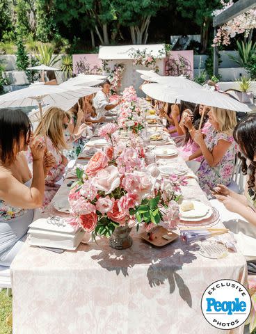 <p>Lisette Gatliff </p> Guests are surrounded by flowers as they sit down for a bite at Sierra Furtado's bridal shower